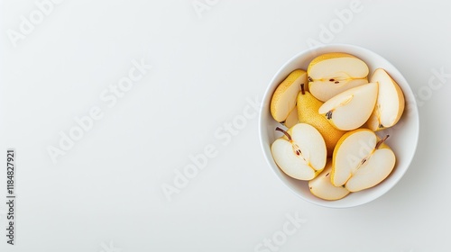 White bowl of sliced fresh pears on a white background, minimalistic fruit composition, isolated healthy snack, juicy organic produce, top view with copy space

