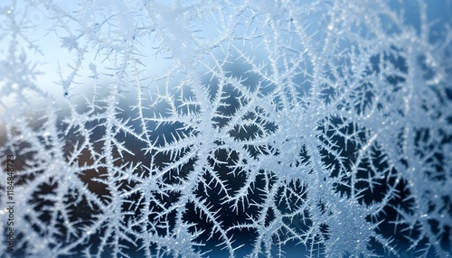 Intricate frost crystals on a cold window photo