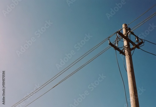 High Voltage Power Lines Gracefully Stretching Across the Horizon at Sunset, Radiating Energy