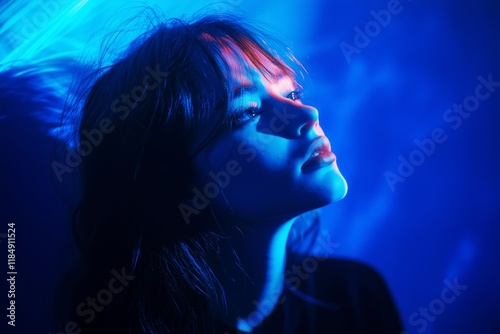 A serene portrait featuring soft blue lighting that accentuates the peaceful expression and beauty.