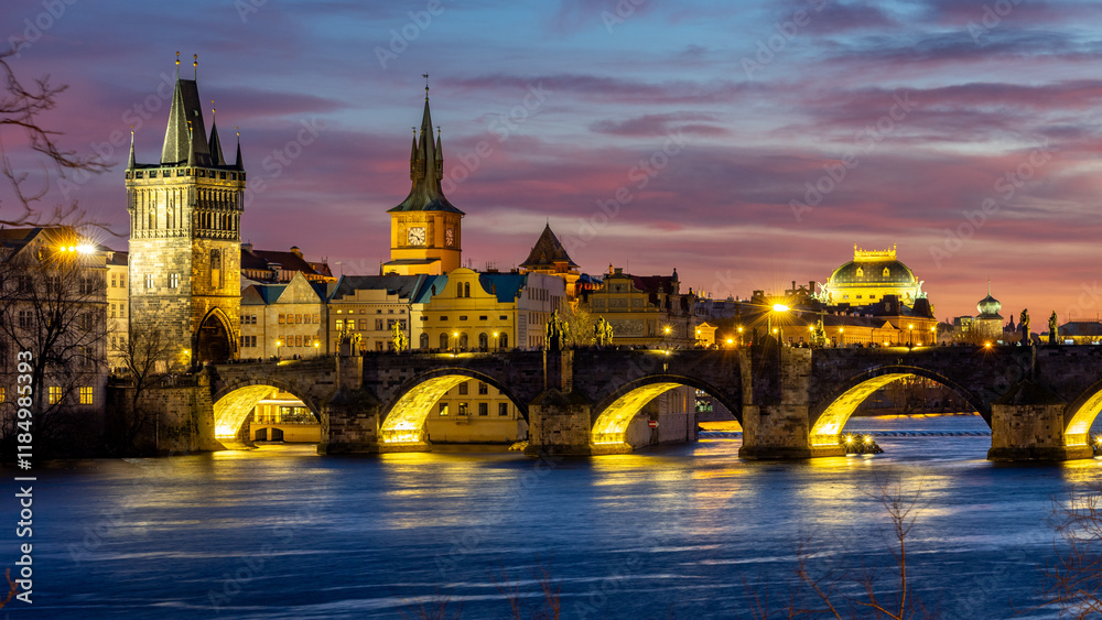 Fototapeta premium Blue hour after a fiery sunset over historic Prague - with the iconic Charles Bridge