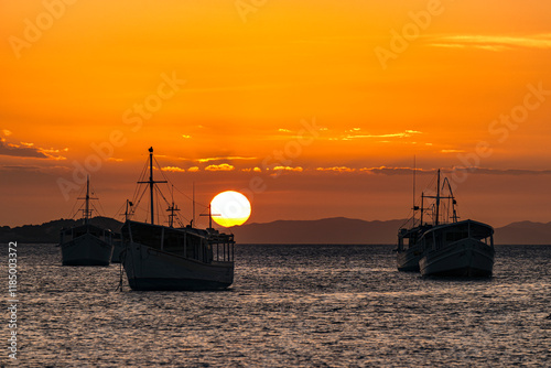 Landscape themes: Fishing boats in Juan Griego Bay at sunset. Margarita Island, Venezuela. photo
