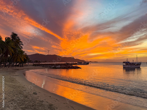 Fototapeta Naklejka Na Ścianę i Meble -  Colorful and beautiful sunset in Juan Griego Bay. Margarita Island, Venezuela.