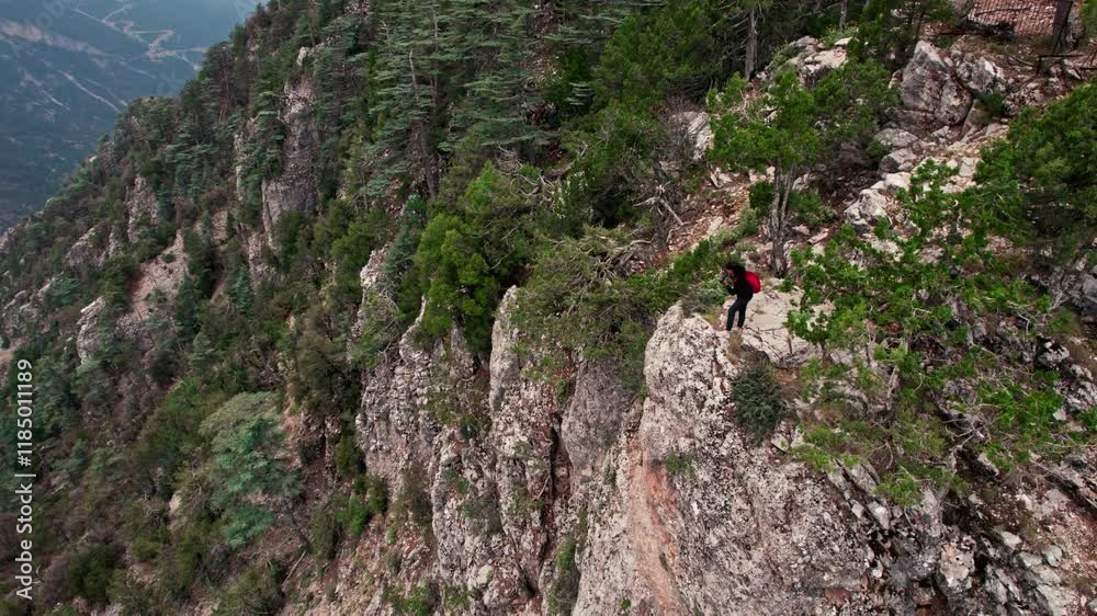 A nature photographer takes a photo of landscapes Surrounded by lush greenery, the scene reflects,with nature and the art of photography. A nature photographer takes a photo of landscapes Surrounded by lush greenery, the scene reflects,with nature and the art of photography.