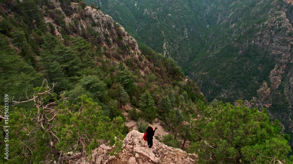 A nature photographer takes a photo of landscapes Surrounded by lush greenery, the scene reflects,with nature and the art of photography. A nature photographer takes a photo of landscapes Surrounded by lush greenery, the scene reflects,with nature and the art of photography.