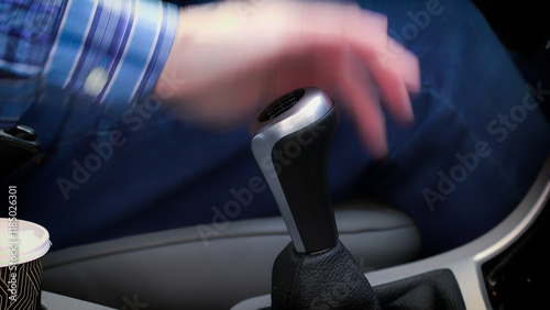 Obraz na płótnie Driver shifting gears in car with motion blur w salonie