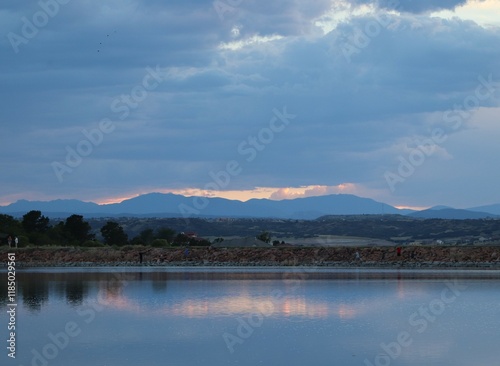 Reflection of Rocky Mountain sunset on Denver, Colorado lake.