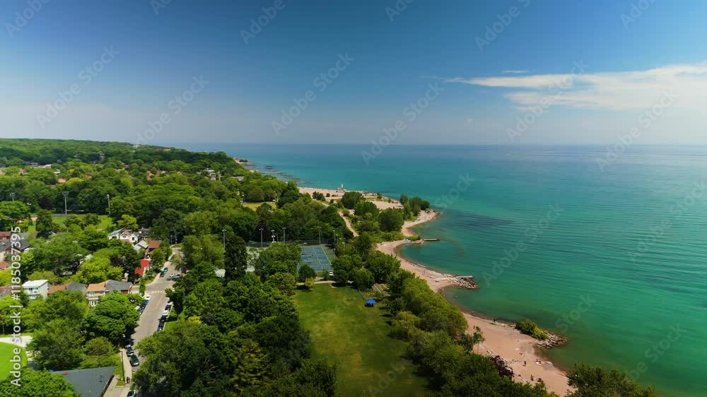 A Perfect Sunny Beach Day Filled with Relaxed Visitors Enjoying Time by the Water. Canada, Ontario, Toronto, Woodbine Beach A Perfect Sunny Beach Day Filled with Relaxed Visitors Enjoying Time by the Water. Canada, Ontario, Toronto, Woodbine Beach