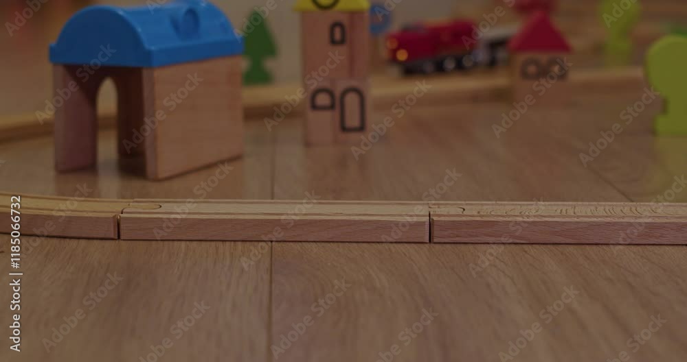 A Colorful Wooden Toy Train Set is Spread Out on the Floor, Ready for Play and Exploration