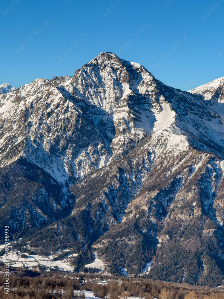 High aerial of snow covered Vialattea mountain peaks and ski slopes in Italian Alps High aerial of snow covered Vialattea mountain peaks and ski slopes in Italian Alps