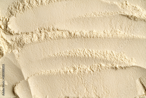 Background made of whey protein powder, top view