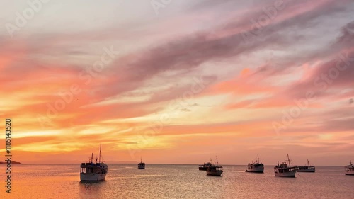 Fishing boats during a beautiful sunset in Juan Griego beach, Margarita Island. Venezuela