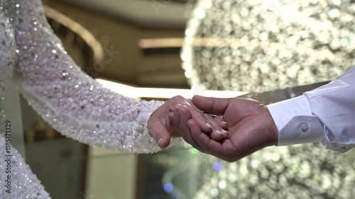 Bride and groom holding hands
