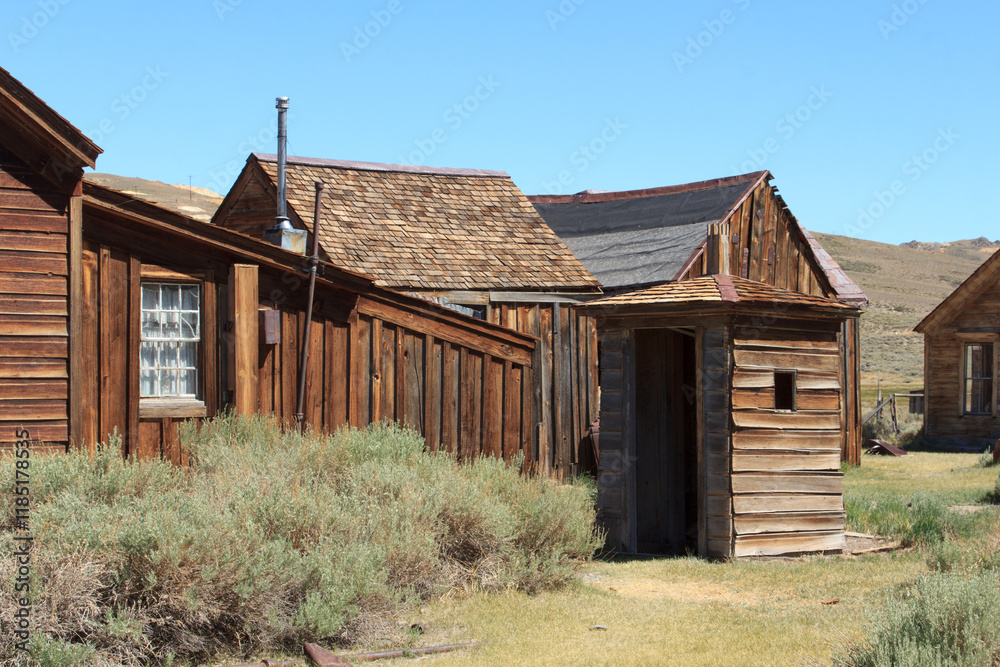 A small building with a window and a door A small building with a window and a door