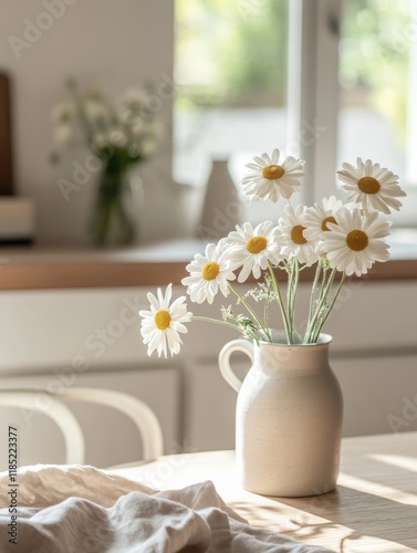 Daisies in a vase on a sunl...