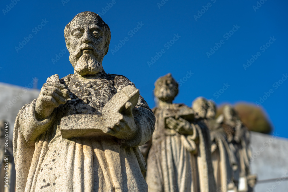 Stone statue representing several saints, with emphasis on Saint Stephen, belonging to the episcopal garden of the city of Castelo Branco-Portugal. Stone statue representing several saints, with emphasis on Saint Stephen, belonging to the episcopal garden of the city of Castelo Branco-Portugal.