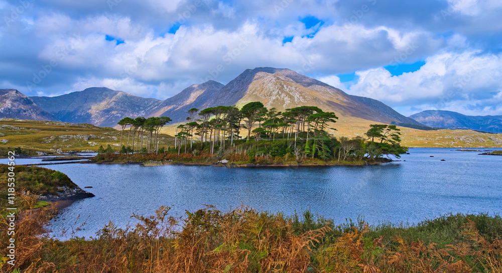 Connemara National Park in Ireland aerial view - The breathtaking view of the magnificent mountains, combined with rolling green hills and a cloudy sky, is stunning Connemara National Park in Ireland aerial view - The breathtaking view of the magnificent mountains, combined with rolling green hills and a cloudy sky, is stunning