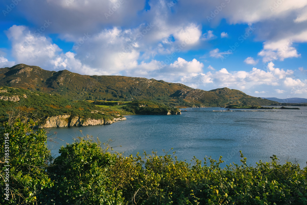 Donegal Ireland - A stunning and scenic view of a tranquil coastline enriched with vibrant greenery and calm, serene waters Donegal Ireland - A stunning and scenic view of a tranquil coastline enriched with vibrant greenery and calm, serene waters