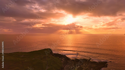 Muckcross Head Donegal Ireland - The breathtaking view of the vast ocean at sunset showcases captivating and colorful cloud patterns
