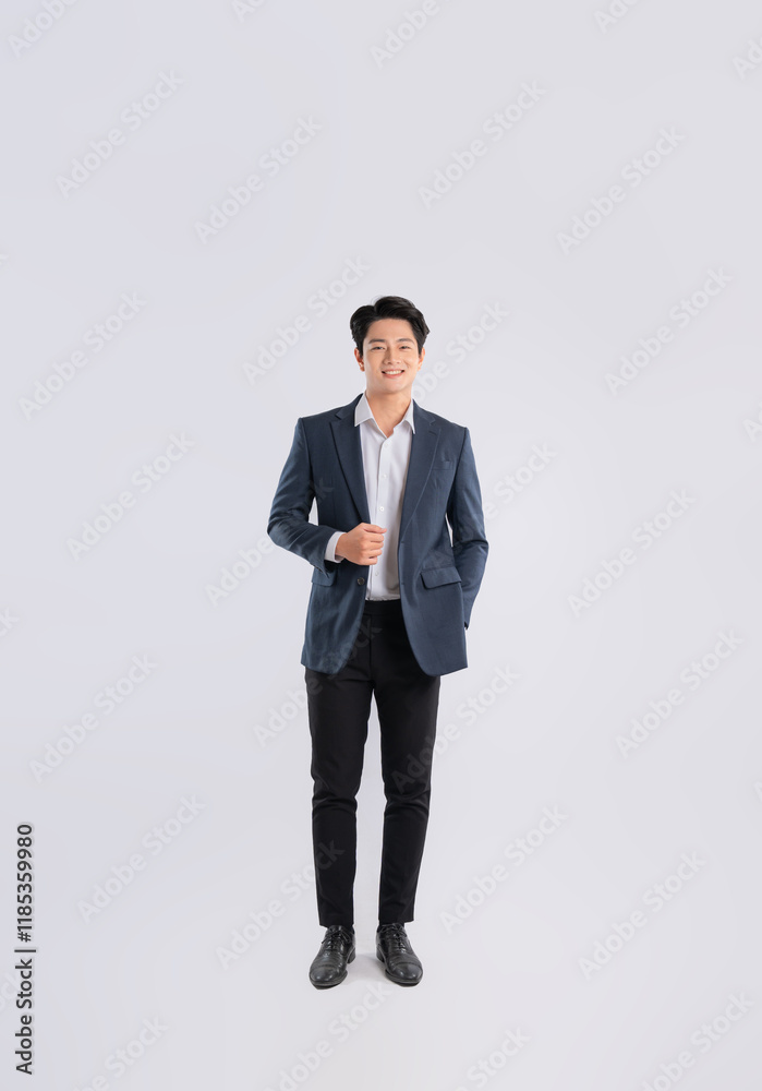 Full body image of a young Asian business man posing on a white background Full body image of a young Asian business man posing on a white background