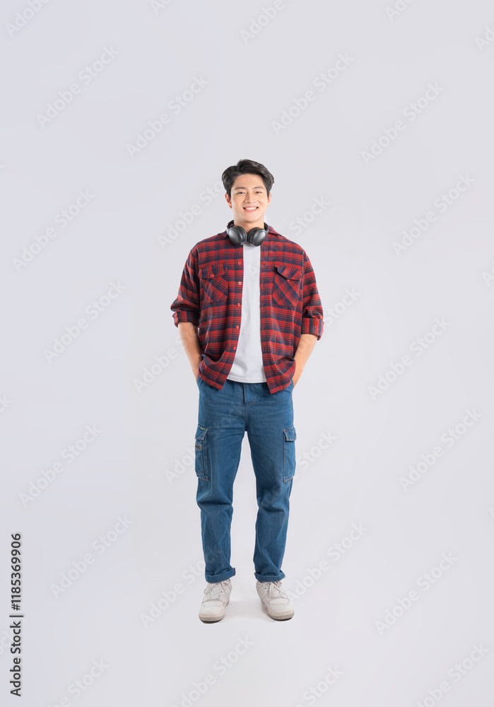 Fototapeta premium Full body image of young dynamic Asian man posing on white backgroundmage