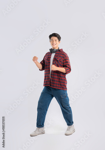 Full body image of young dynamic Asian man posing on white backgroundmage photo