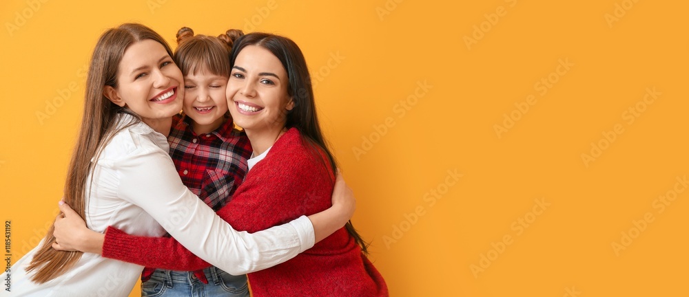 Φωτογραφία Happy lesbian couple and little adopted girl on orange background with space for
