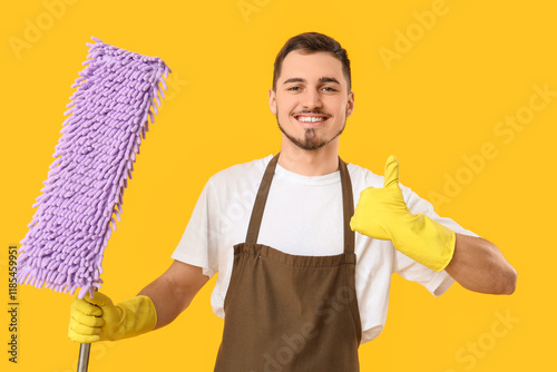 Male janitor with floor mop...