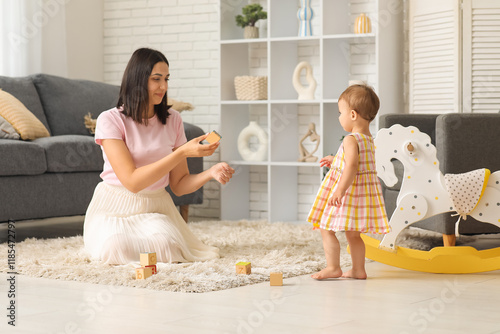 Mother with cubes and her l...