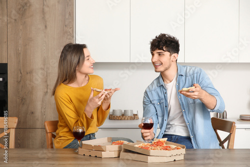 Young couple with wine eati...
