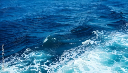 Turquoise waves crashing on a tropical beach under a clear blue sky with sandy shores and a beautiful ocean horizon photo