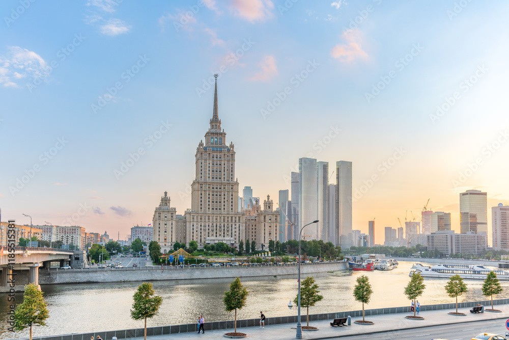 Obraz premium High-rise stalinist building near river at summer sunset in Moscow, Russia. Historic name is Hotel Ukraine.