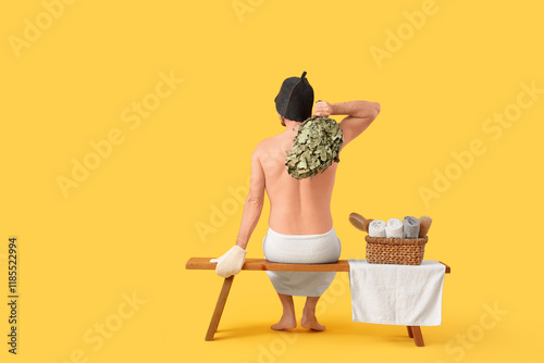 Young man with sauna whisk ...