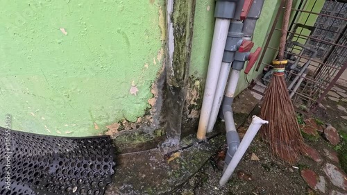 Wallpaper Mural Weathered Wall with Pipes and Cleaning Tools Torontodigital.ca