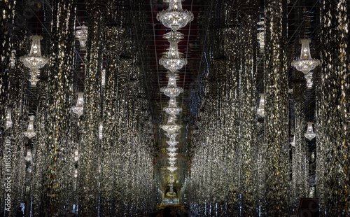 Obraz na płótnie Interior decoration view of Chantaram temple (Wat Tha Sung) or The sung crystal temple with complex featuring an adorned with shiny, mirrored tiles & columns and Glittering ceiling lights. Copy space. w salonie