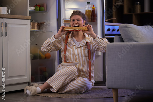 Hungry young woman eating s...