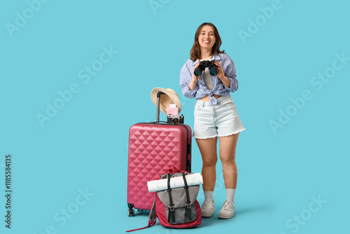 Female traveler with binocu...