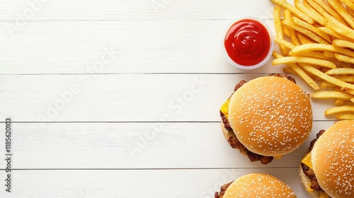 Fast food chicken burgers and fries on white wooden table with ample copy space ideal for Super Bowl or minimalist design themes photo