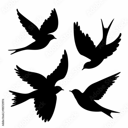 Four birds flying in the sky. They are all black. The birds are in different positions. One is in the middle, and the other three are on the right side