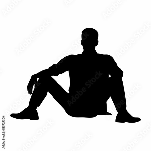 A man is sitting on the ground. He is wearing a shirt and jeans. He is not wearing shoes