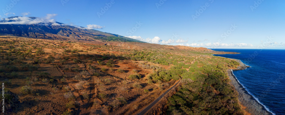Fototapeta premium A road trip along the Maui South Piilani Highway during golden sunset hour