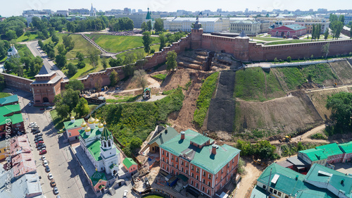 City view with a green building in the middle photo