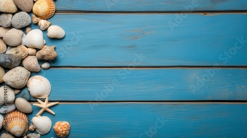 Coastal Decor with Seashells and Pebbles on Blue Wooden Surface photo