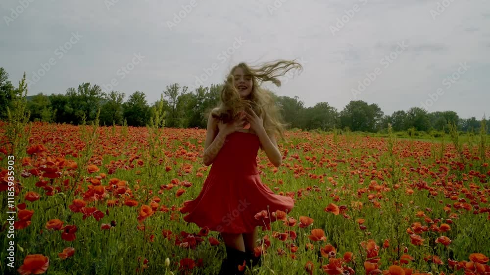 Happy woman in a red dress on spring poppy field. Spring field of blossom poppies. Portrait of romantic spring woman with poppy flower. Spring beauty model on poppy field, springtime. Blossom flowers. Happy woman in a red dress on spring poppy field. Spring field of blossom poppies. Portrait of romantic spring woman with poppy flower. Spring beauty model on poppy field, springtime. Blossom flowers.