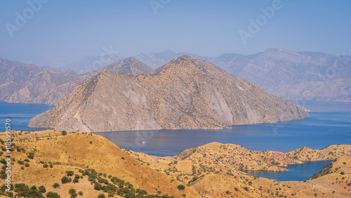 Scenic mountain landscape view of Nurek dam lake on Vakhsh river between Dushanbe and Khatlon, Tajikistan photo