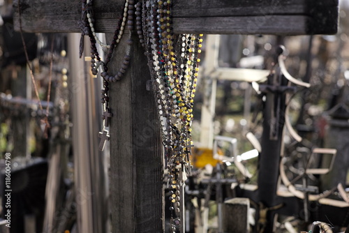 Thousands of religious symbols, crucifixes, rosaries, rosary and catholic crosses with Jesus, Hill of Crosses, Kryžių kalnas,  is a site of pilgrimage north of of Šiauliai, Lithuania