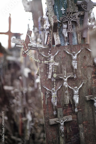 Thousands of religious symbols, crucifixes, rosaries, rosary and catholic crosses with Jesus, Hill of Crosses, Kryžių kalnas,  is a site of pilgrimage north of of Šiauliai, Lithuania