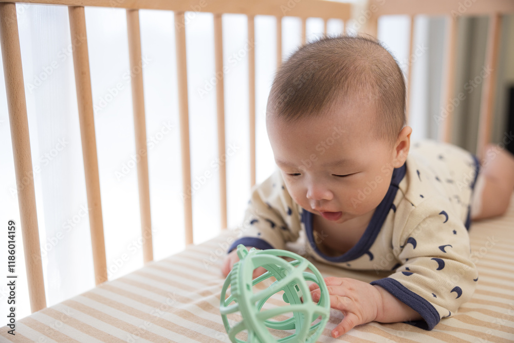 Baby turning over crawling and chewing teether Baby turning over crawling and chewing teether