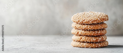 Sesame cookies stacked on a...