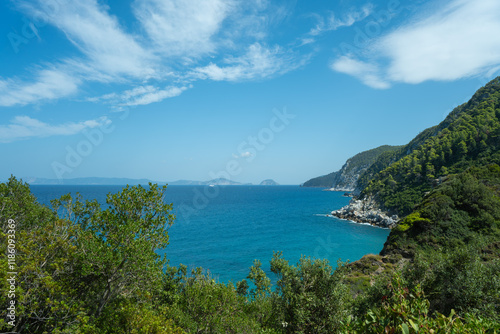 View of the sea, mountains, rocks, beaches, islands and the sky from different sides of the Skopelos island Greece.